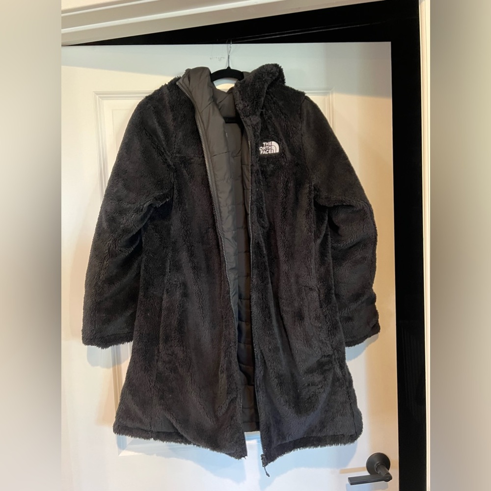 Reversible north face jacket. Fuzzy on one side and the shell on the other side.